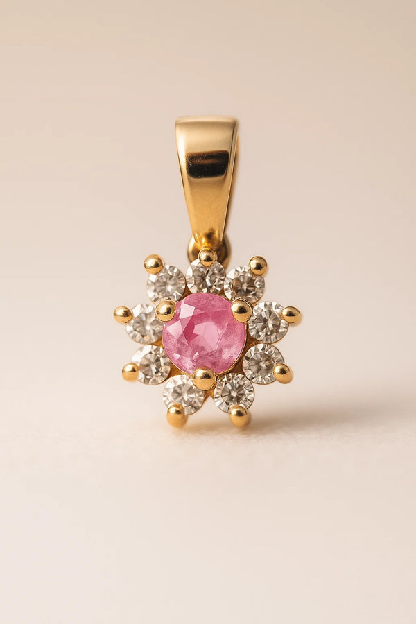 Dije de flor en oro 18k con zafiros rosas y diamantes en los pétalos