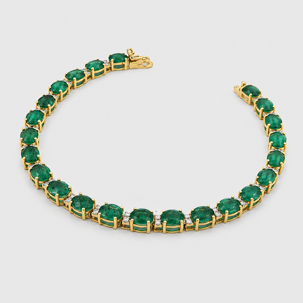 Pulsera de tenis con esmeraldas en línea continua de oro