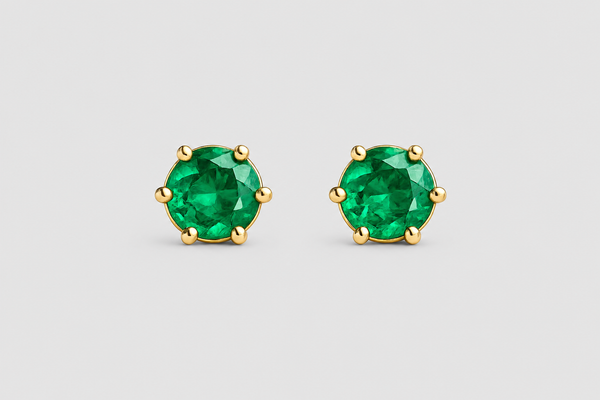 Broqueles solitario con esmeralda de 4.7 mm en oro
